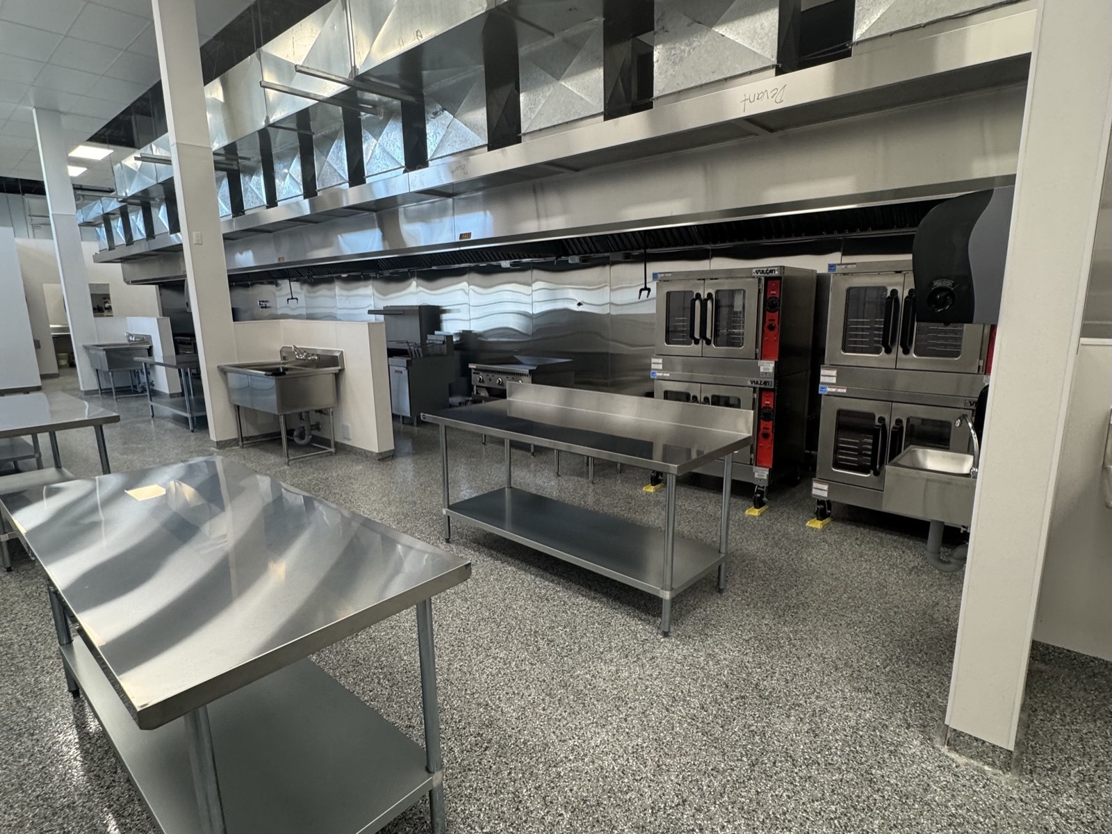 Prep tables, kitchen stations, and commercial ovens at PurePrep Langley